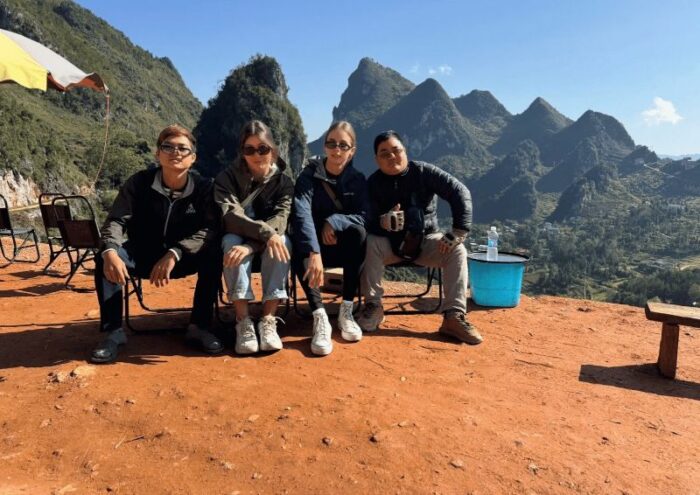 small-group-ha-giang-loop-3d2n-tour-with-guide-at-a-mountain-viewpoint